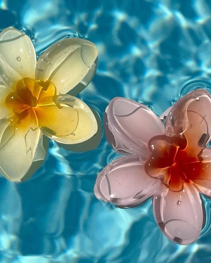 Sunny Clips flower hair clips floating in water