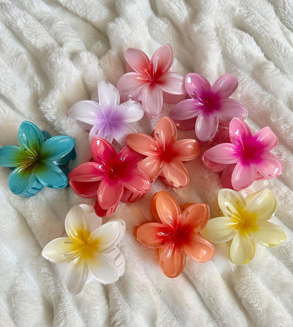 Sunny Clips flower hair clips on white towel